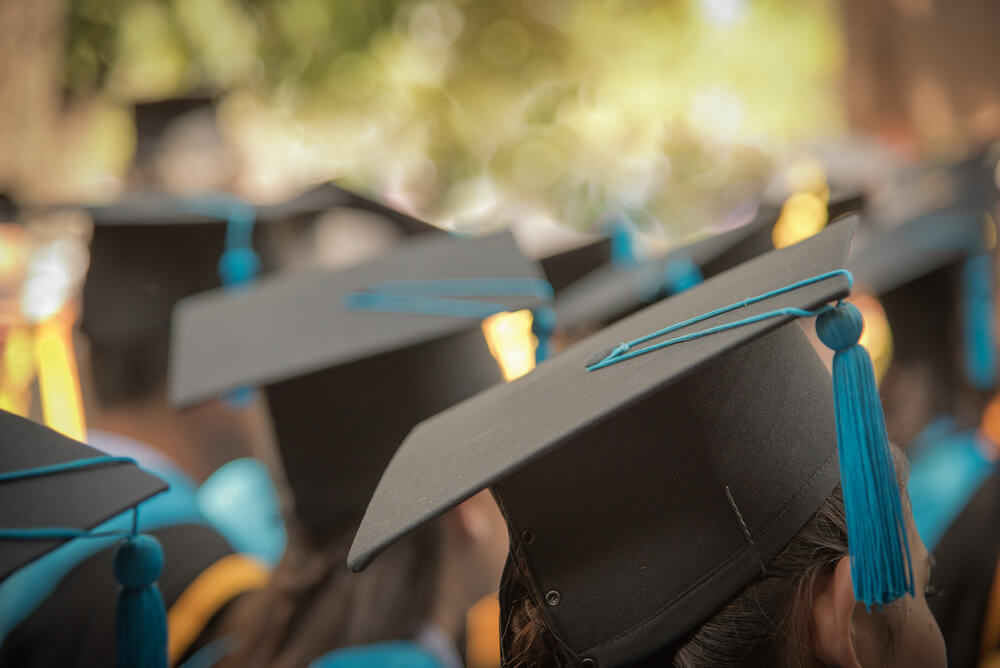 image of people wearing graduation hats