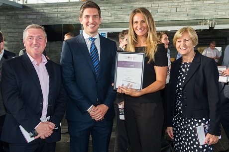image of Kirsty collecting an award