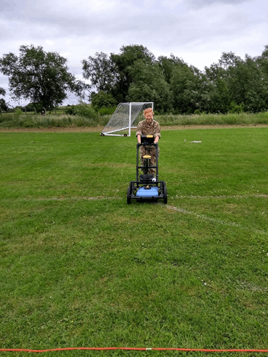 Image of Jane mowing the lawn