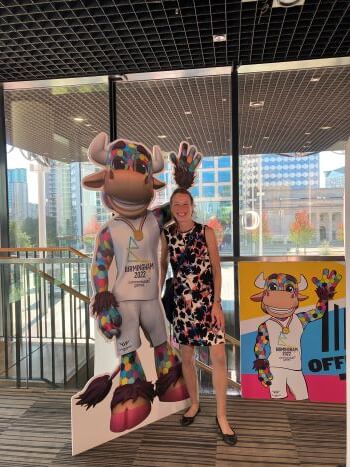 Image of Rachel next to the mascot for the commonwealth games 2022